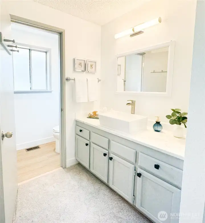Primary bedroom, shower, and toilet are conveniently enclosed in its own room.