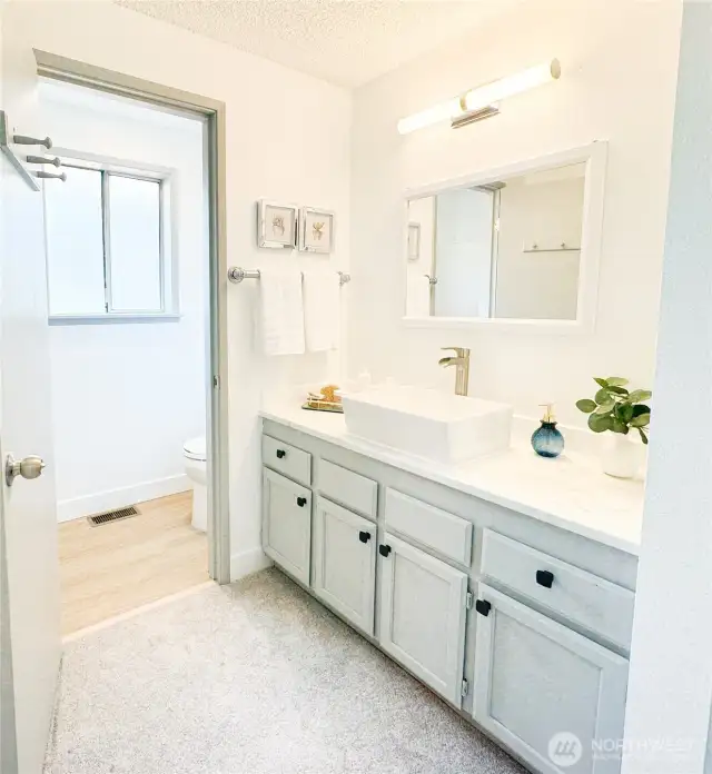 Primary bedroom, shower, and toilet are conveniently enclosed in its own room.