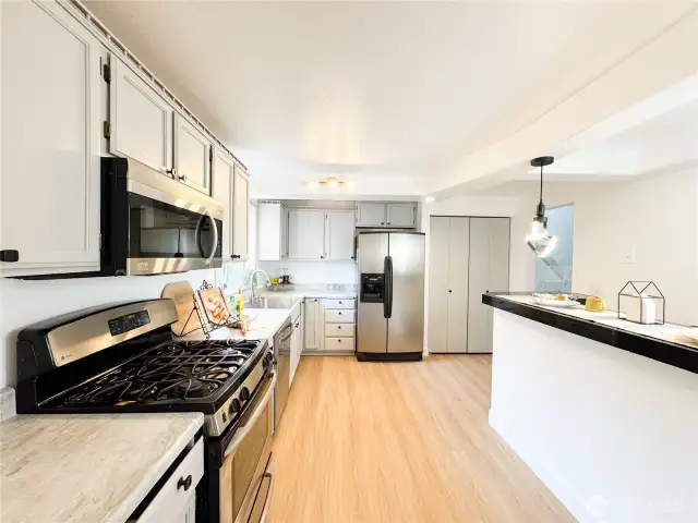3 of top 5 photos: Fully remodeled kitchen with built-in bar area