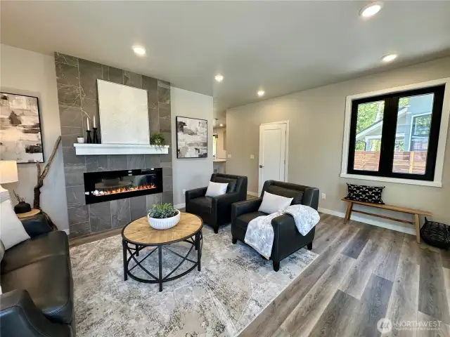 Lovely living space with tiled fireplace and electric LED insert.