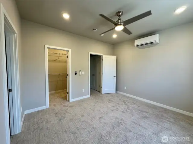 Upstairs primary with walk-in closet and en suite