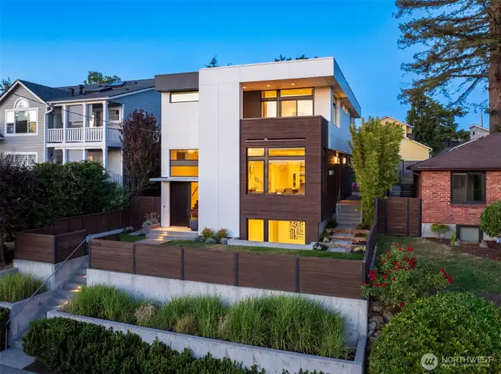 Custom-built Modern home perched above a wide open Maple Leaf street