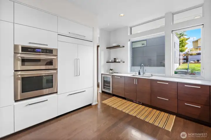 Kitchen showing the integrated JennAir french-door refrigerator and wall oven/microwave