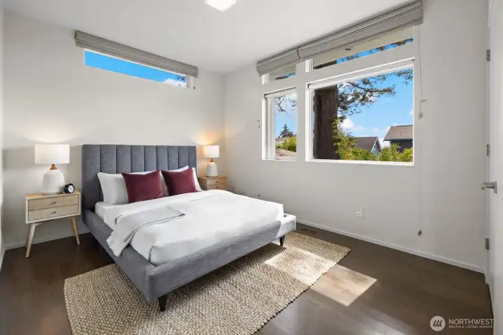 Second upstairs bedroom featuring south facing windows and even a peek-a-boo view