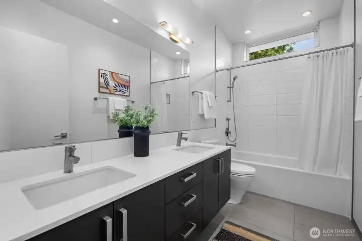 Secondary upstairs bathroom, built 6" wider than standard with a 66" long soaking tub and dual sink vanity