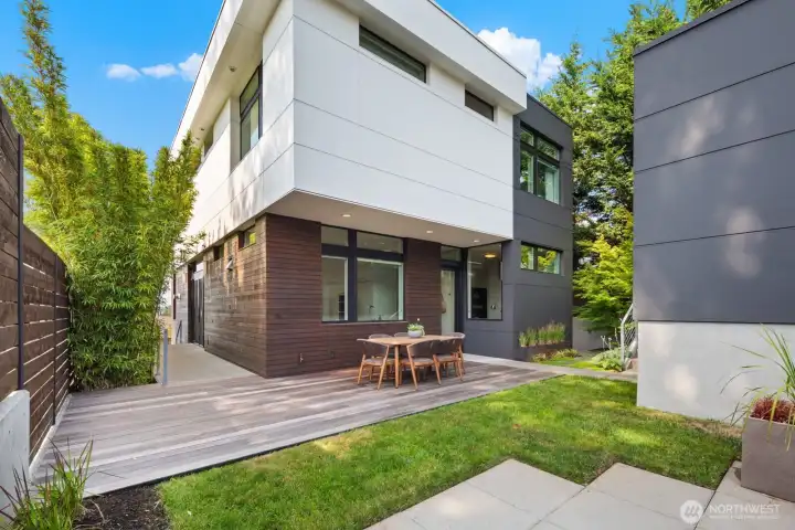 Back yard space, with large entertaining deck built at the same level as the lower yard. Gas stubbed for a BBQ. Detached two-car garage located off to the north side of the lot