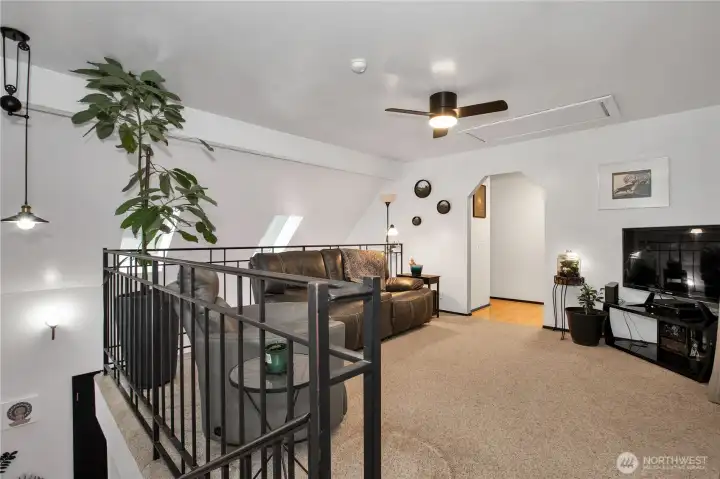 View from the top of the stairs. Doorway takes you into the additional bonus room which is currently the primary bedroom, there is a full bath and walki-n closet.