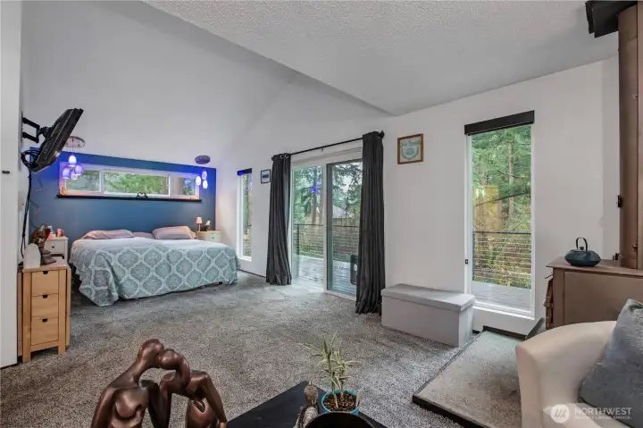 Primary offers lots of windows and deck just off the slider.