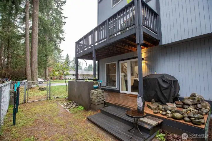 Upstairs deck just off of loft, deck from dining area with fenced side yard and waterfall feature.