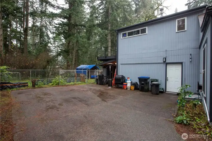 This is at the end of the driveway, there is a a little shed just off of the back for all your yard tools. Door leads into the mud/laundry room. The fenced area in the back yard was a chicken coop.
