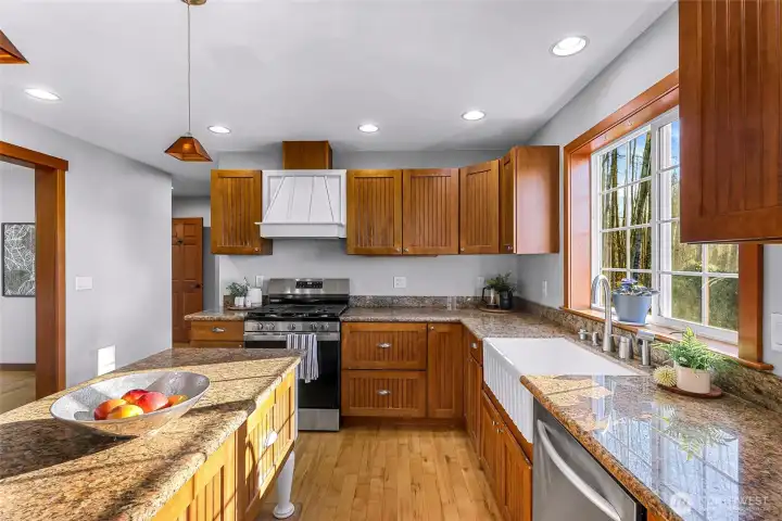 Additional kitchen angle highlights ample counter space, storage, and sightlines to adjoining rooms. A practical workspace designed for efficiency without sacrificing connection.