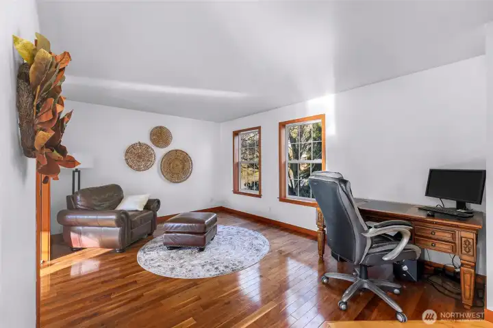 Dedicated office or flex room offers a quiet workspace with natural light. Ideal for remote work, hobbies, or additional living needs.