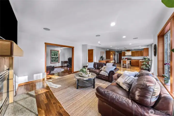 Alternate living room angle highlights open flow and comfortable scale. Designed to accommodate gatherings while remaining easy to maintain.