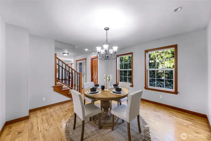 Dining area offers comfortable space for everyday meals and gatherings. Positioned for easy flow from kitchen and living areas.