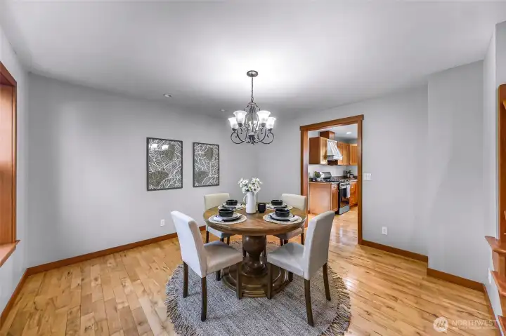 Formal dining room provides flexibility for hosting or alternative uses. Neutral finishes allow for easy personalization.