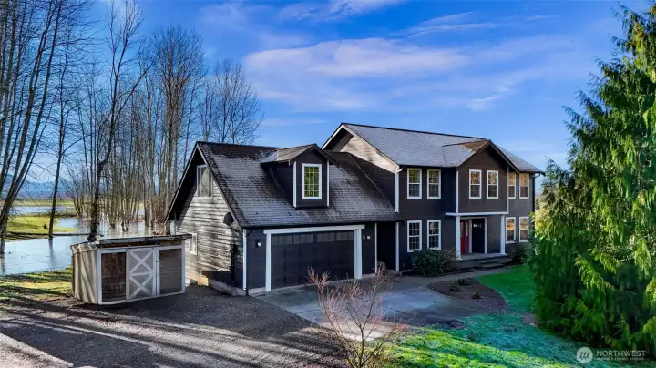 Aerial perspective shows the home centered within nearly 10 acres, offering privacy, views, and usable land. Elevation supports confidence in drainage and site selection.