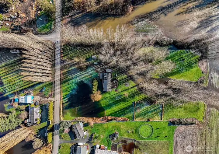 Overhead view highlights garden space, access points, and overall land layout. A versatile property suited for rural living, recreation, or small-scale agricultural use.