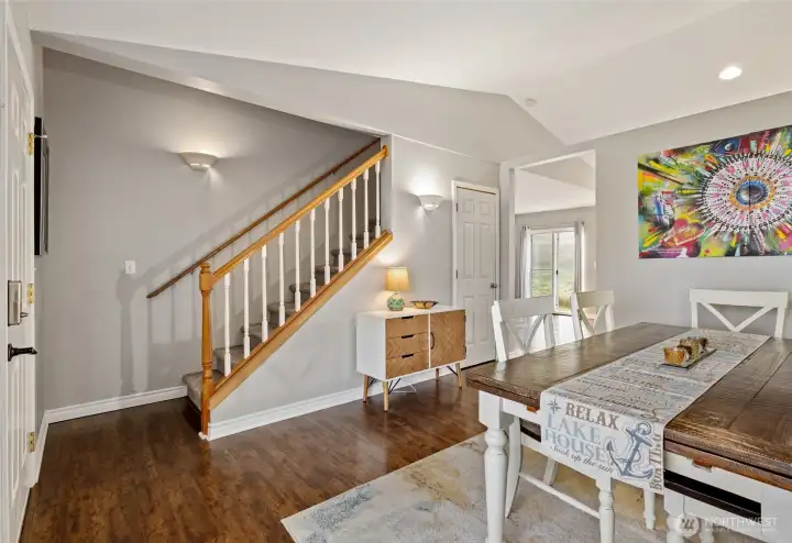 Stairs and hallway to kitchen and second living room