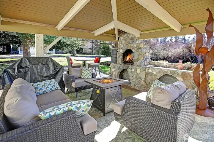Enjoy the outdoor covered patio with a wood burning fireplace