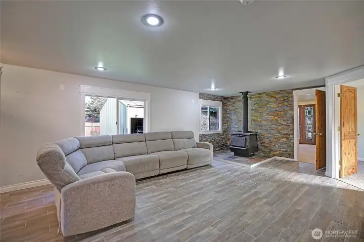 Large living room leading to the primary suite on the main level.