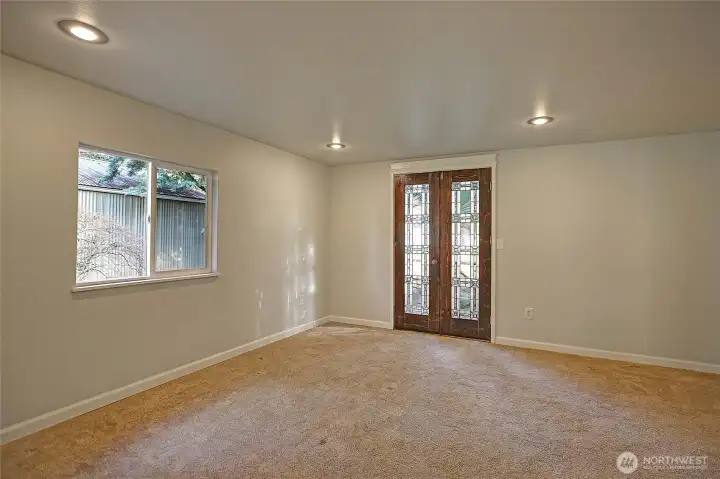 Primary suite on the main level has its own entry creating a great option for multi-generational living.