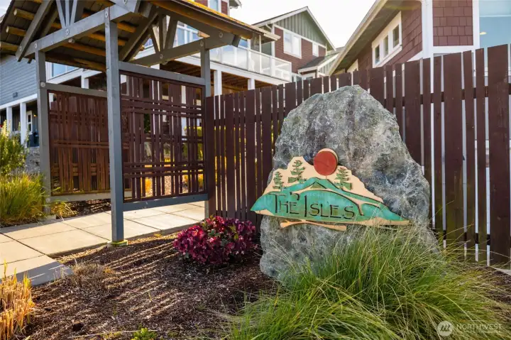 Community signage with an attractive entrance to access main level entry of home.