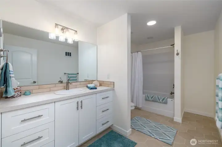 Full bathroom located on lower  level.