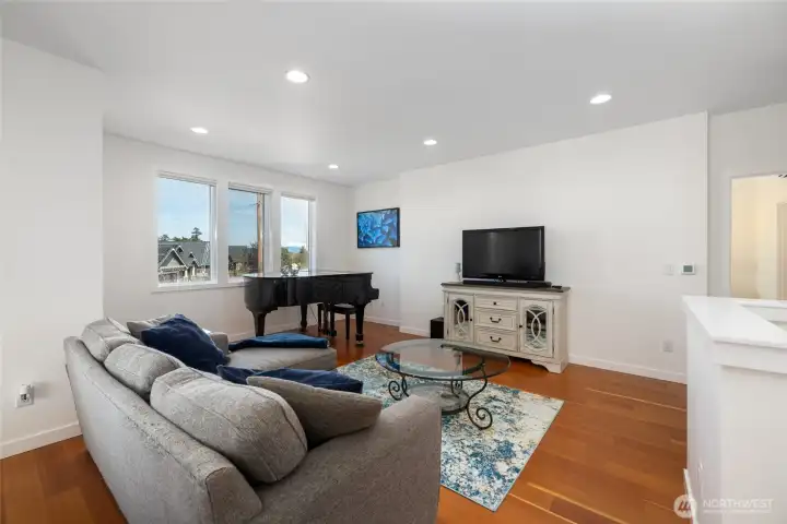 View of living room from the middle of open concept floor plan on main level.