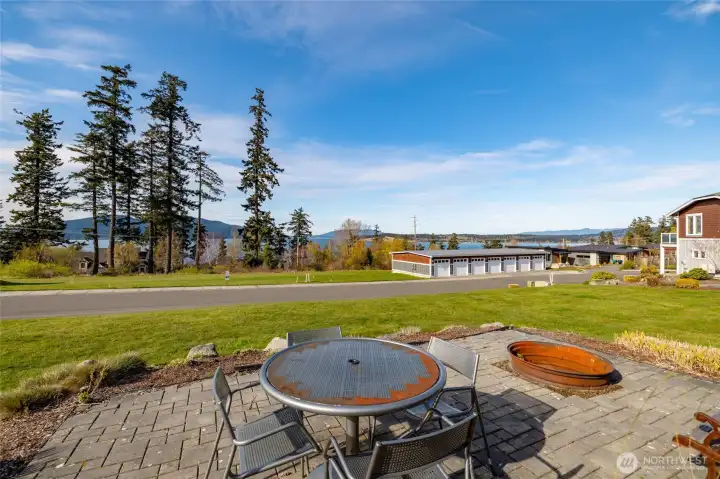 The club house has additional uncovered out door seating with a fire pit and an amazing view of the water.