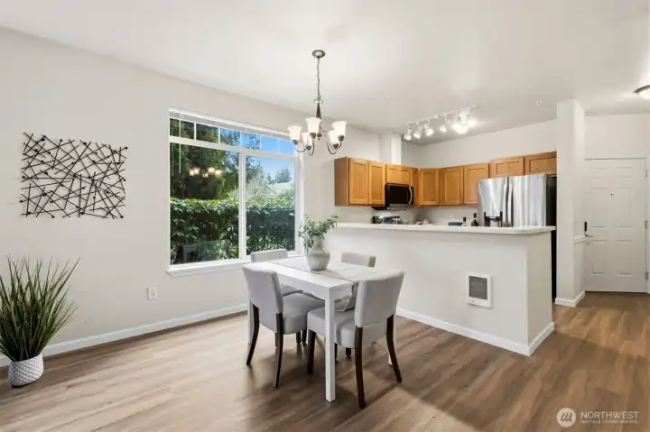 Dining area conveniently located between kitchen and living room.