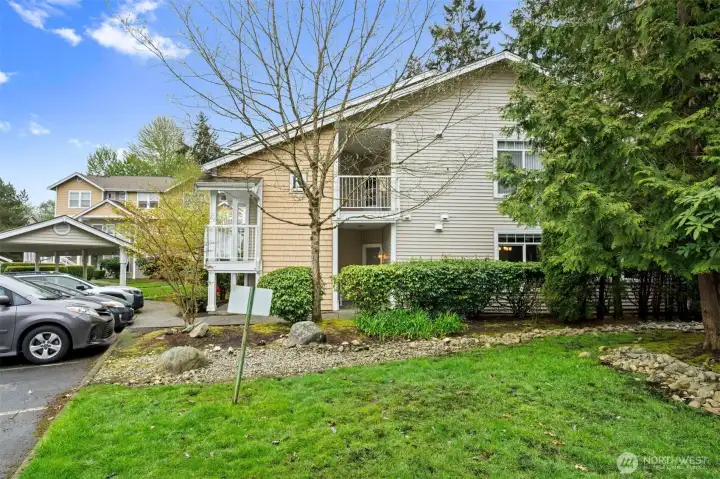 Grassy common area adjacent to patio creates spacious feel.