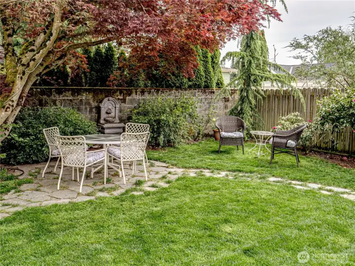 Yard is level with patios and paths to seating