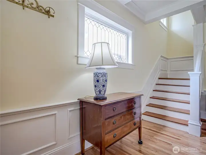 Details of trims, wainscoting, fully-wrapped windows, base trim and crown and beamed ceilings create a timeless look. Hardwood floors throughout the home.
