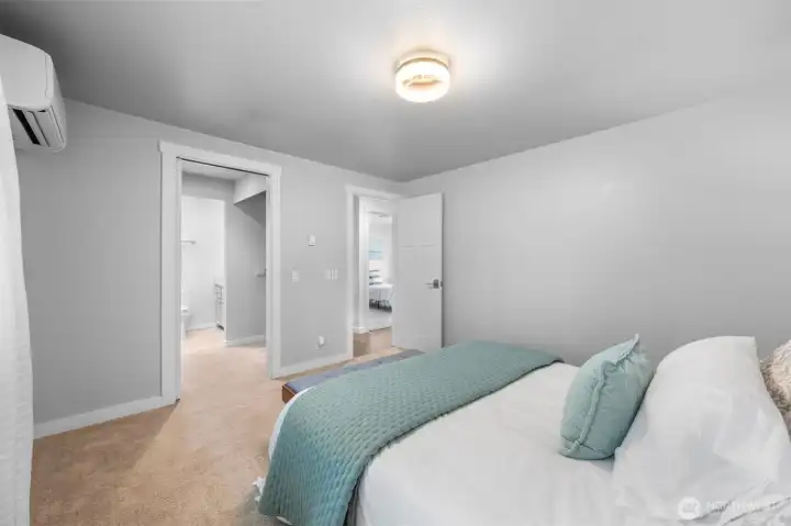 Spacious primary suite with flexible furniture options