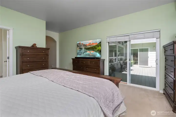 Primary room with sliding glass door to spacious deck.
