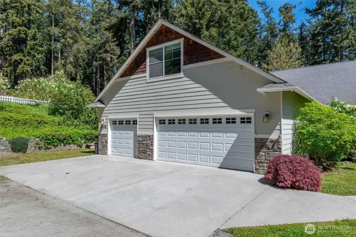 Three car garage with bonus room above.