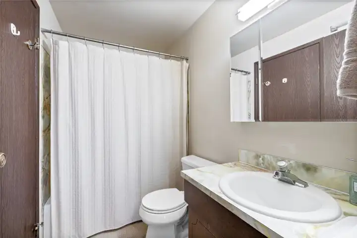 Upstairs bathroom with tub and shower