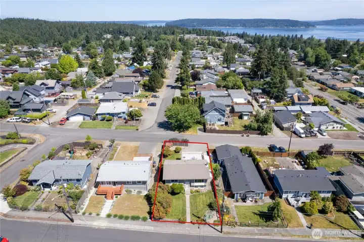 Property runs the full lot, street to street.