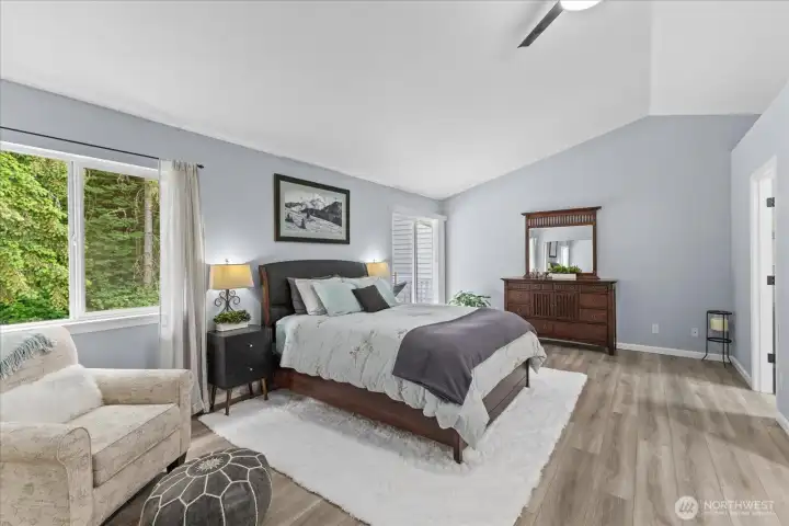 This primary suite easily accommodates a king-size bed and multiple wardrobe cabinets. The 19"' X 13' room is enhanced by vaulted ceilings and a private patio, with the ensuite bath conveniently located to the right. This primary suite easily accommodates a king-size bed and multiple wardrobe cabinets. The 19"' X 13' room is enhanced by vaulted ceilings and a private patio, with the ensuite bath conveniently located to the right.
