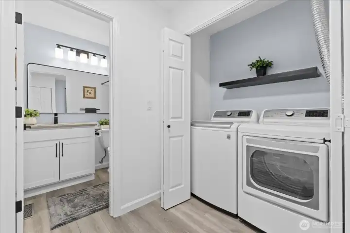 Conveniently located, squeaky-clean laundry space featuring newer LG appliances that convey with the property. Conveniently located, squeaky-clean laundry space featuring newer LG appliances that convey with the property.