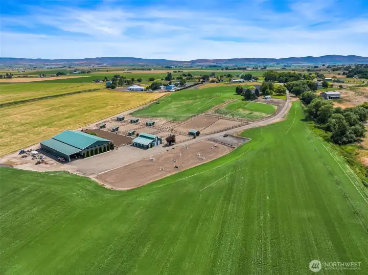 Burkeridge Farm offers a rare Country Estate lifestyle that blends seamlessly with fine Equine facilities, mountain views, producing hay field and water rights. This unique property was thoughtfully created for function and beauty in mind.  One of Ellensburg's most beautiful settings and peaceful surroundings