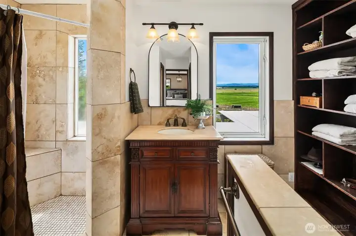Stone primary bath with tremendous valley and mountain views