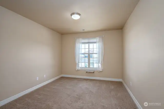 This room could be an office or workout room. We are considering it the 4th bedroom. It doesn't have a closet but an armoire would work well or there is a wall not in this view that a closet could be built. This room is adjacent to the primary bedroom.