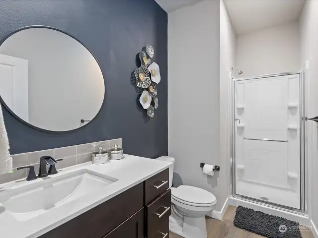 Conveniently located on the main level of this stunning home, you'll find a spacious 3/4 bath that combines both style and functionality. Upon entering, you're greeted by an atmosphere of modern elegance, with sleek fixtures and contemporary design elements that create a sophisticated ambiance.