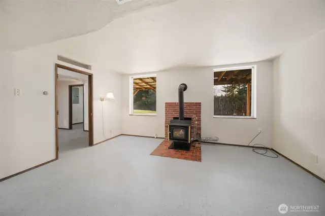 Family room with woodstove in basement.