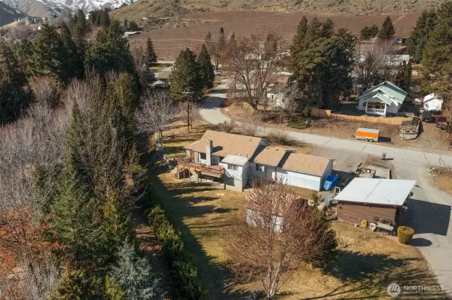 Aerial looking at the back of the house & property.
