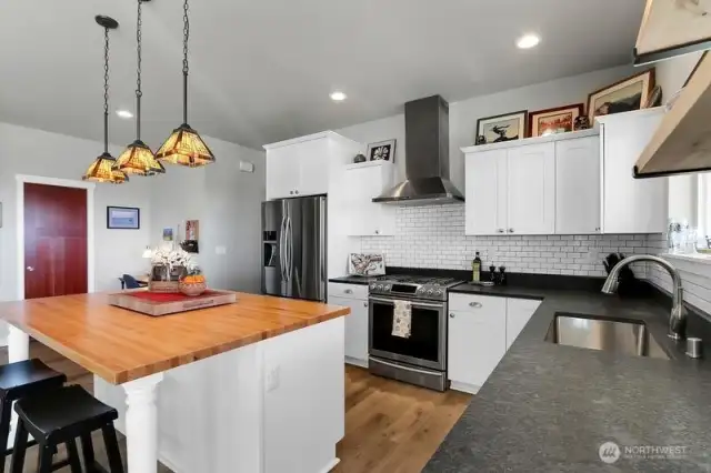 Granite countertops, butcher block island and eas access to the deck for outdoor dining
