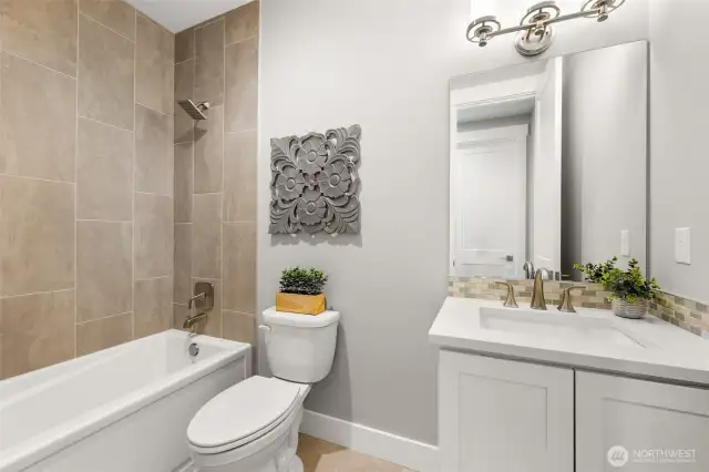 A beautifully appointed main hall bath.