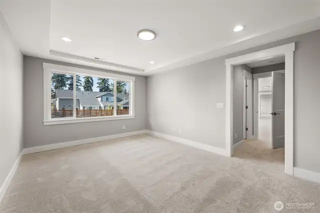 Grand lower level guest/secondary suite includes a closet and direct access to the full bath.