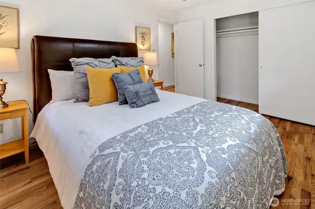 Primary bedroom on the main floor has generous closet space.